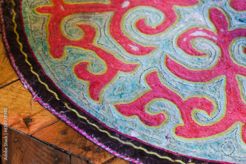 Handmade felt mat with traditional ornaments, Altai republic © evannovostro