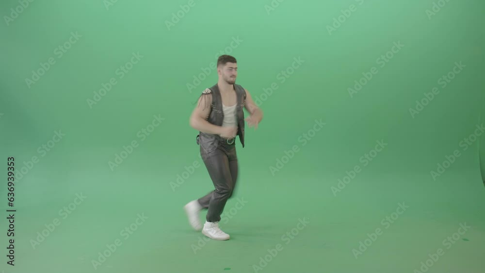 Angry Caucasian Man in Black leather costume dancing Pop Moves on Green Screen - 4K Video Footage
