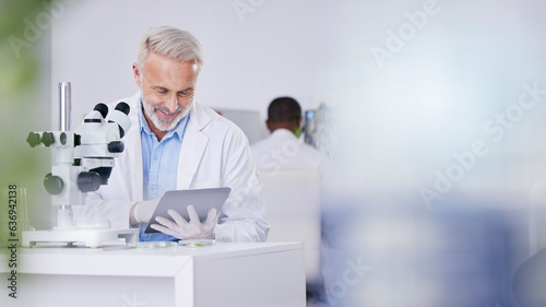 Science, lab and man with tablet, research and biotech with plants, botany or sustainable medicine mockup. Professional scientist in study on nature, growth and digital report of leaves in laboratory