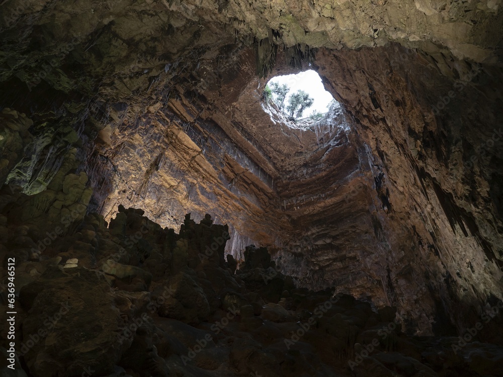 Large hole in karst cave Grotte di Castellana in Italy