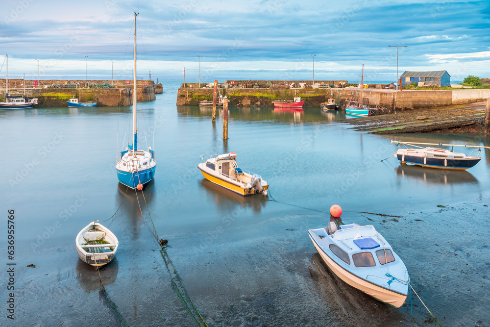 Moored boats in the picturesque harbour at St Monans village in Fife, Scotland.