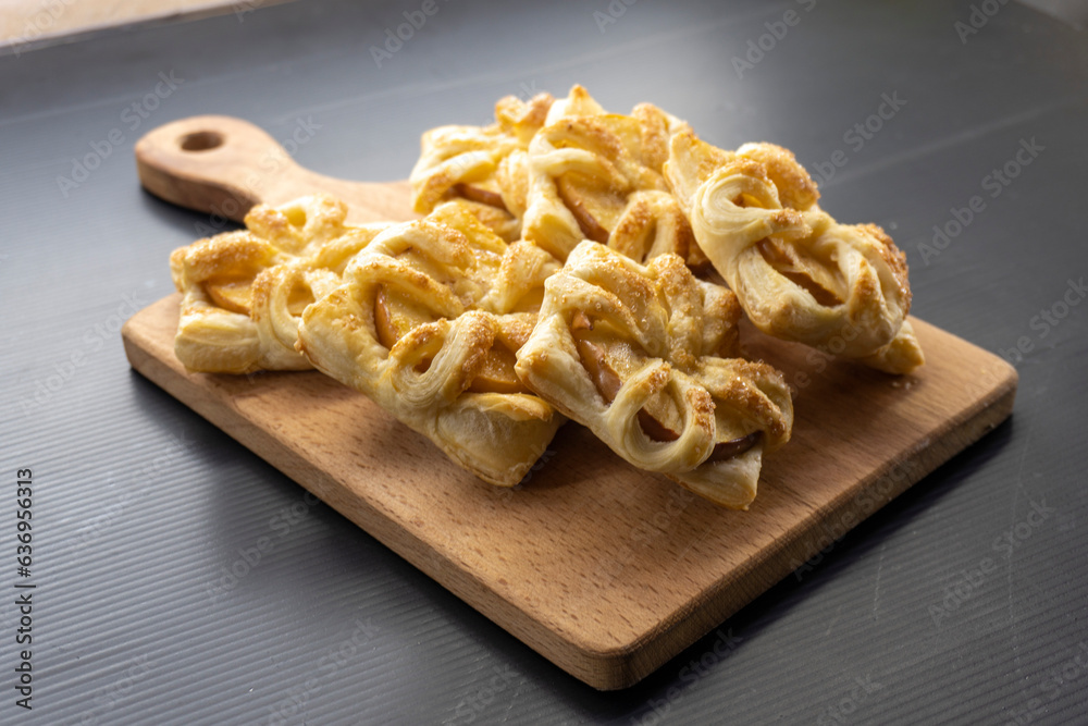 Puff pastry apple tarts on black background.food concept. dessert. bakery Puff pastry apple tarts on black background.food concept. dessert. bakery