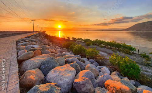 Sunset on Road on Palisadoes a thin strip of sand that serves as a natural protection for Kingston Harbour, Jamaica