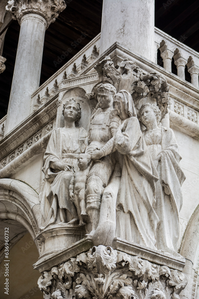Photo of a detailed statue on the facade of a building in Venice, Italy