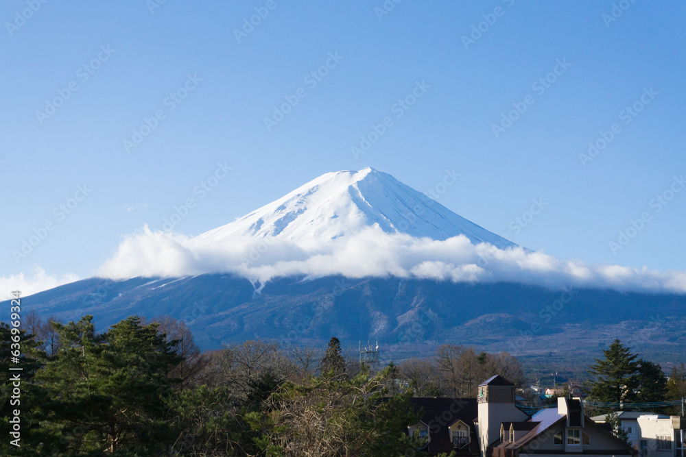 Mt. Fuji with snow on top and cloud in the middle