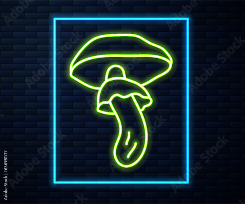 Glowing neon line Psilocybin mushroom icon isolated on brick wall background. Psychedelic hallucination. Vector