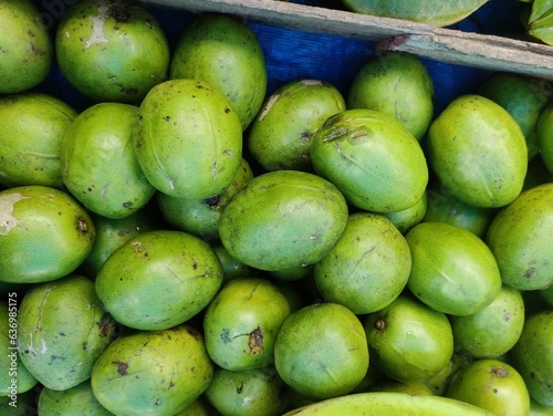 Ambarella fruit, golden apples or jew plums, are sweet and sour tropical fruits that can be eaten both ripe and unripe. Scientific name - Spondias dulcis. It is a very nutritional food.  photo