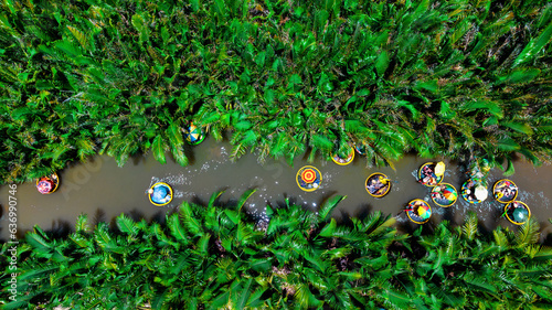 Bamboo basket boats on Thu Bon River, Coconut village eco tour in Hoi An, Vietnam. photo