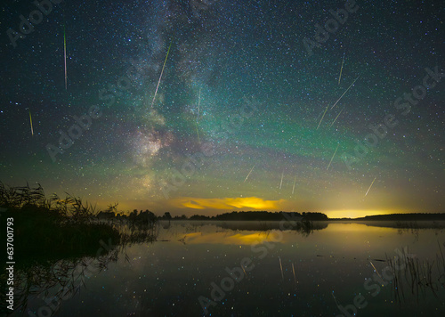 Milky way galaxy and perseid meteor shower. Green glow in the night sky.