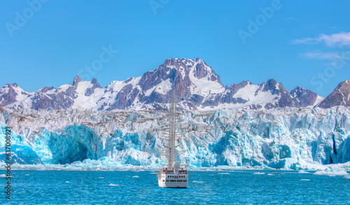 Knud Rasmussen Glacier near Kulusuk - A blured research ship in the foreground - Greenland, East Greenland photo