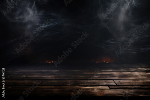Wooden table in front of a fire and smoke on a dark background