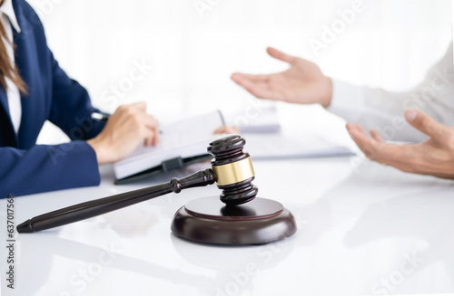 Professional female lawyer or counselor discussing negotiation legal case with client meeting with document contract in office, law and justice, attorney, lawsuit concept.