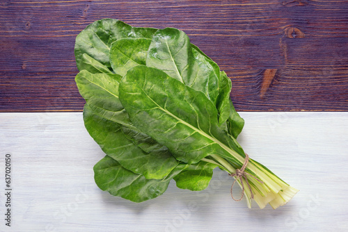 Balkan cuisine. Blitva ( chard leaves ) - popular leafy vegetables on rustic table photo