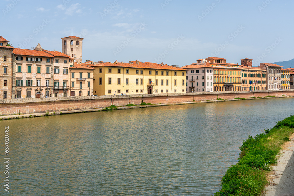 Beautiful sight in Pisa with the Arno River on a sunny summer day. Tuscany, Italy.