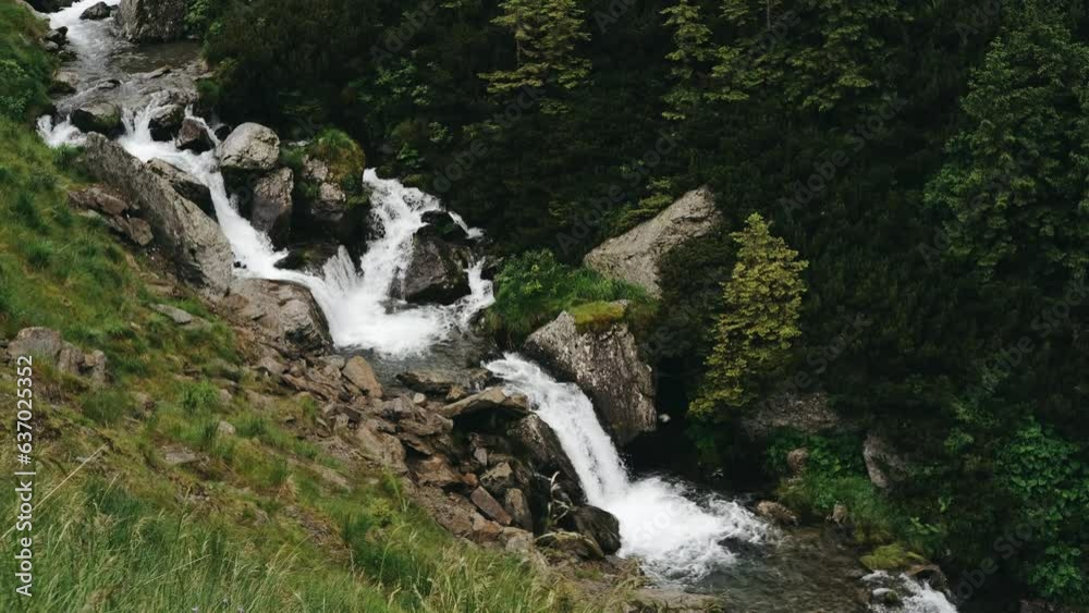 Mountain waterfall Balea river flowing in Transfagarasan road in summer. Mountain waterfall Balea river flowing in Transfagarasan road in summer.