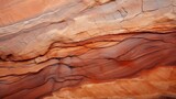 A detailed image of a sandstone's weathered texture pattern, showcasing the erosion, layers, and natural color variations in tones of beige, orange, or red
