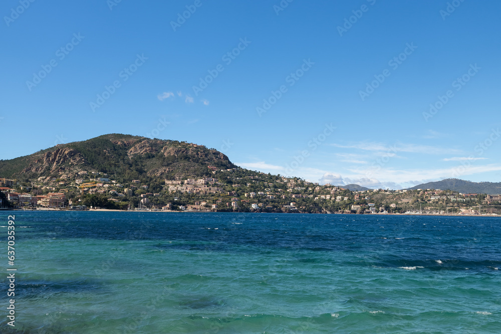 View of Theoule-Sur-Mer from a beach in spring