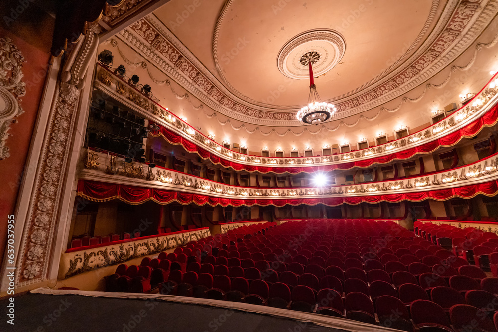 Fototapeta premium Big theatre sitting hall. Cinema modern interior seating place.