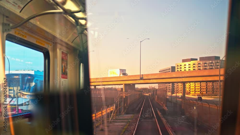 Approaching shot of beautiful skyscrapers and railway at sunset Subway train approaching to huge skyscrapers by railway Concept view from windshield subway wagon to aesthetic urban landscape at sunset Approaching shot of beautiful skyscrapers and railway at sunset Subway train approaching to huge skyscrapers by railway Concept view from windshield subway wagon to aesthetic urban landscape at sunset