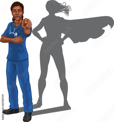 A super hero black woman doctor or nurse medical healthcare health professional in scrubs pointing. Revealed to be a superhero by her shadow.