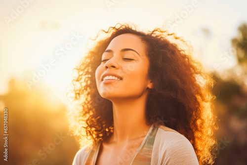 Mixed race woman relax and breathing fresh air outdoors. Portrait of young mixed race woman enjoying her life.