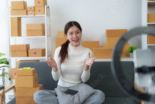 Startup happy Asian woman business owner online selling at home office, Startup small business owner working Online selling. SME Online marketing and product packaging and delivery service. © amnaj