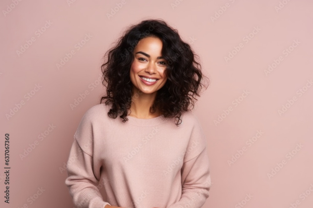 Portrait of a smiling young woman with curly hair, isolated on a pink background Portrait of a smiling young woman with curly hair, isolated on a pink background