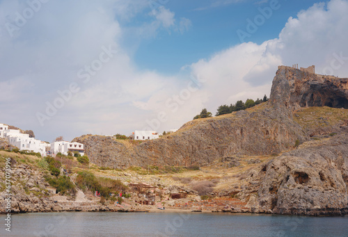 Rhodes, Greece. Lindos small whitewashed village and the Acropolis, scenery of Rhodos Island at Aegean Sea. St. Pauls bay