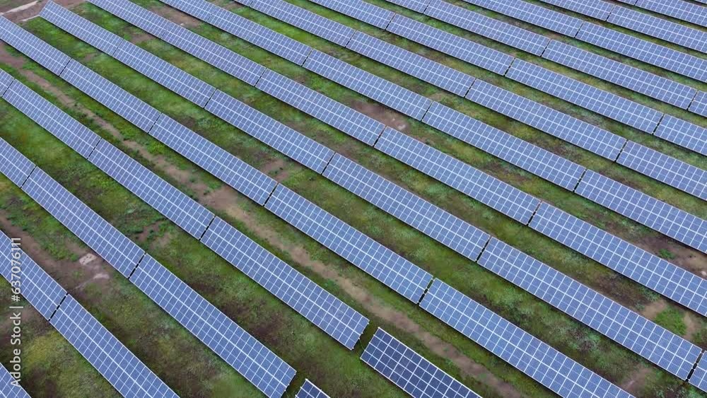 Solar power plant aerial view. Renewable energy. Green tech. Ecology solar panels in the fields green energy landscape electrical innovation nature environment. Solar power plant aerial view. Renewable energy. Green tech. Ecology solar panels in the fields green energy landscape electrical innovation nature environment.