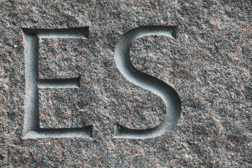 letters on the stone wall