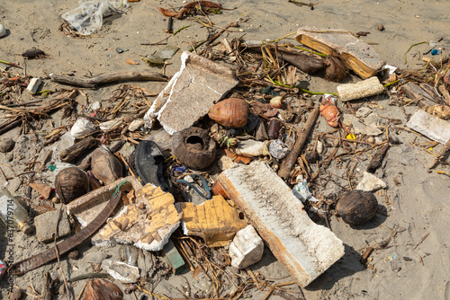 Pile of Trash Washed Up on a Sandy Beach In Kochi Cochin Kerala India
