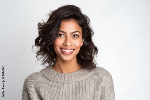 Group portrait of an Indian woman in her 30s against a white background © Eber Braun