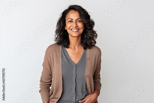 Medium shot portrait of an Indian woman in her 40s against a white background © Eber Braun