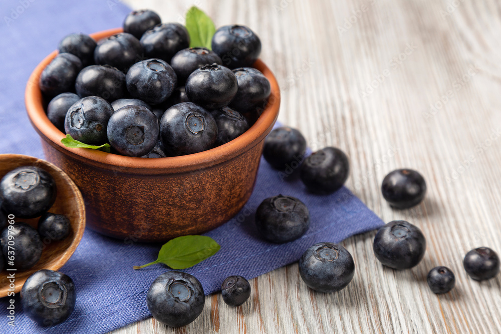 Fresh blueberries in a brown plate Fresh blueberries in a brown plate