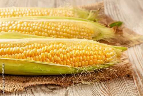 Corncobs on a wooden background