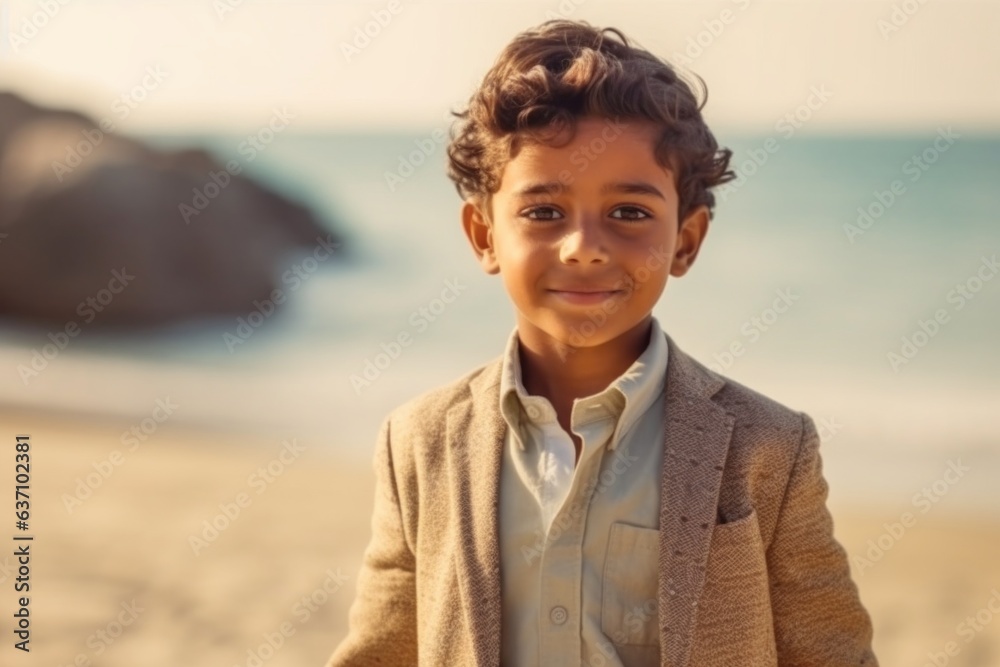 Medium shot portrait of an Indian child male in a beach Medium shot portrait of an Indian child male in a beach