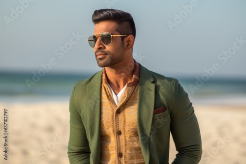 Lifestyle portrait of an Indian man in his 20s in a beach 