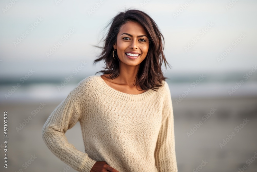 Lifestyle portrait of an Indian woman in her 30s in a beach Lifestyle portrait of an Indian woman in her 30s in a beach