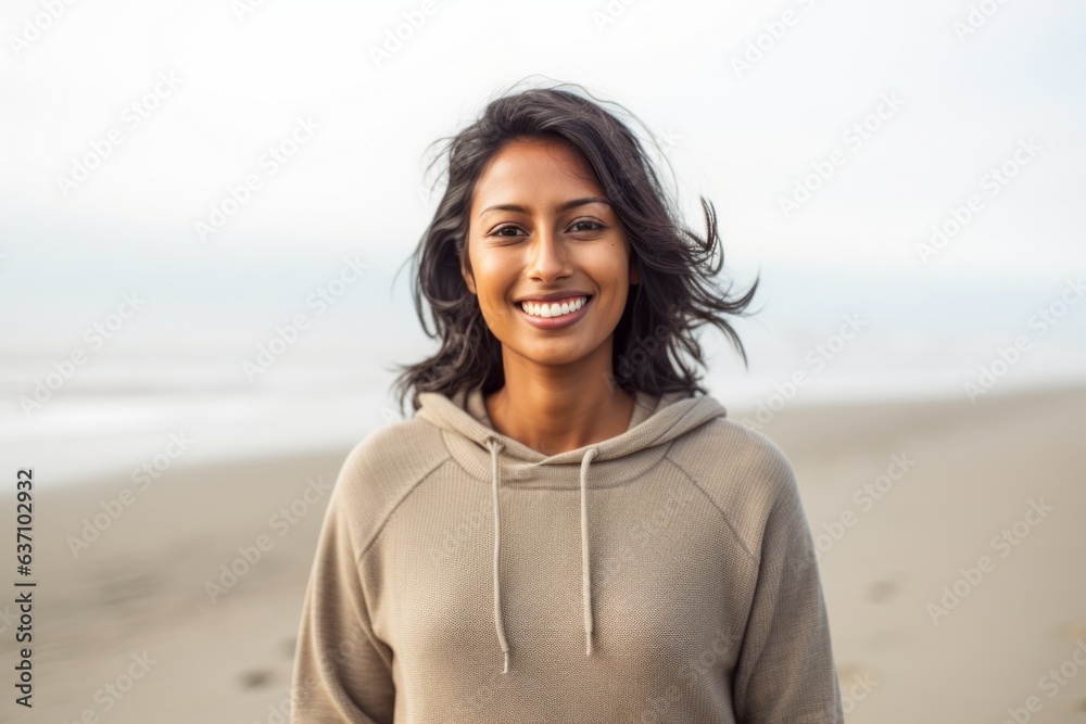 Lifestyle portrait of an Indian woman in her 30s in a beach Lifestyle portrait of an Indian woman in her 30s in a beach