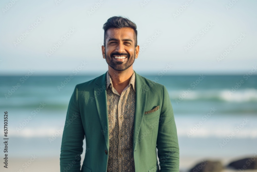 Group portrait of an Indian man in his 30s in a beach Group portrait of an Indian man in his 30s in a beach