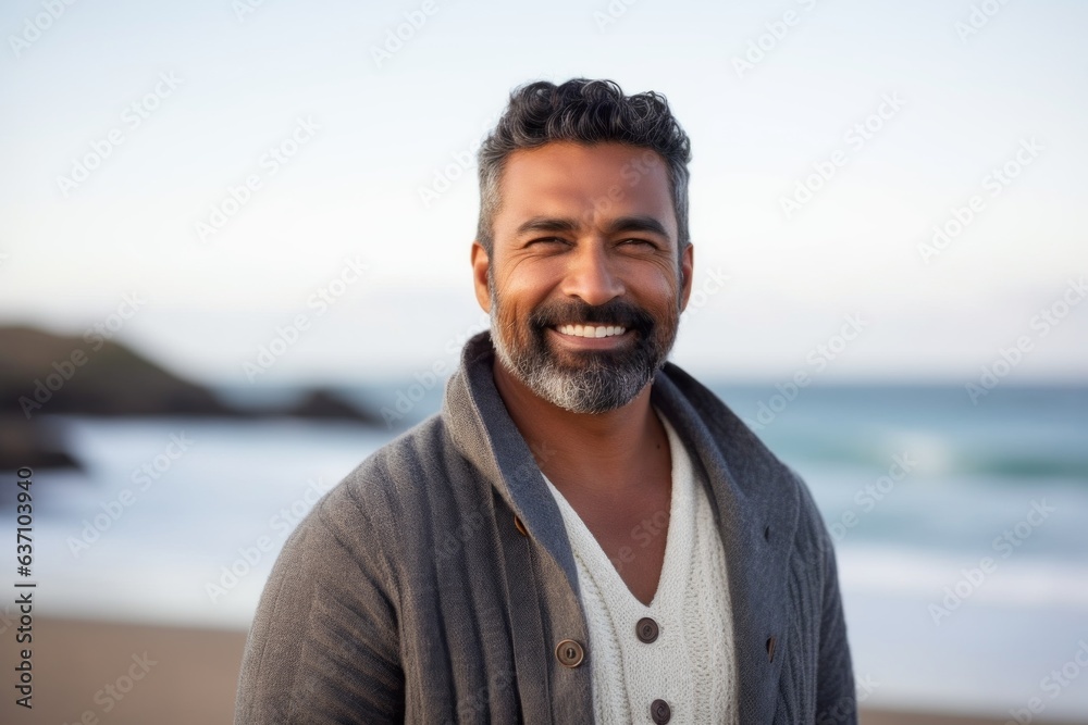 Portrait of smiling man standing on the beach at the day time Portrait of smiling man standing on the beach at the day time