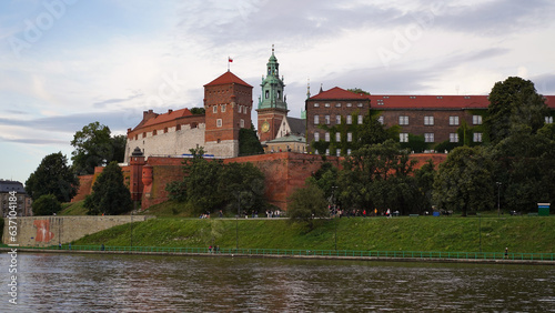 Beautiful old royal Wawel Castle on the banks of Vistula river in the evening. The main historical landmark of Krakow, a popular tourist destination in Poland.Old town, place for vacation and travel.