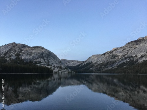 Stunning vista of Tenaya Lake surrounded by majestic mountainous terrain in California