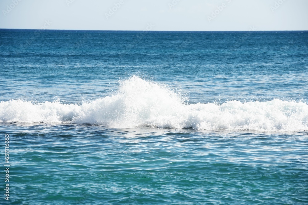 Scenic view of sea waves on a sunny day