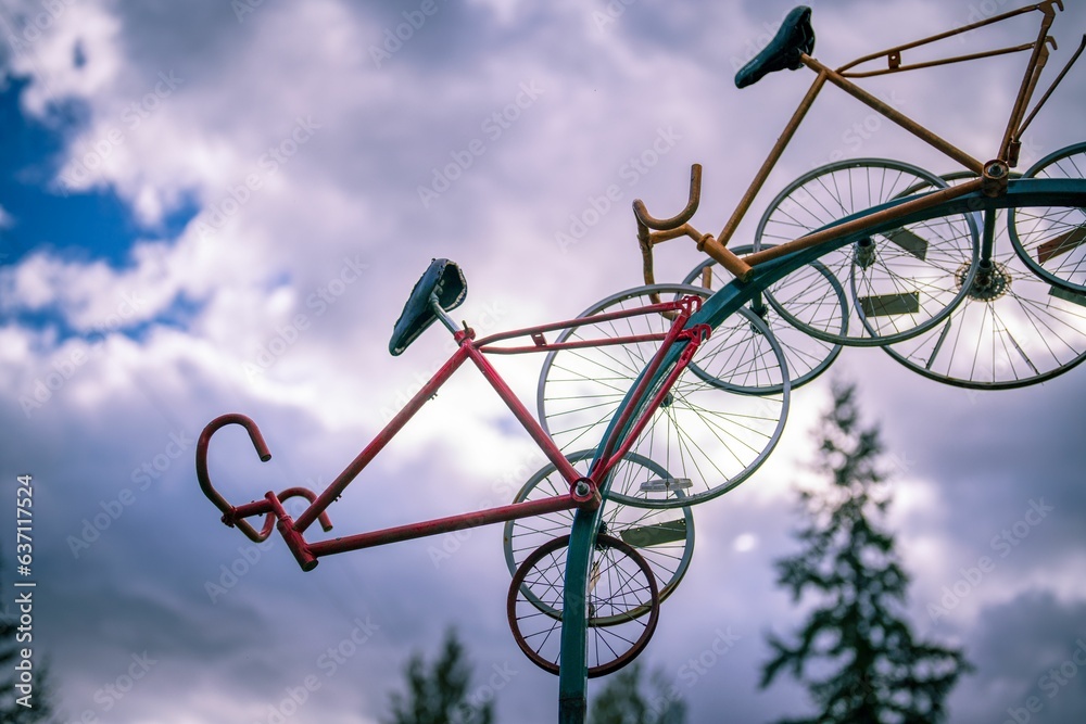 Closeup of bicycles in a playground against the cloudy sky Closeup of bicycles in a playground against the cloudy sky