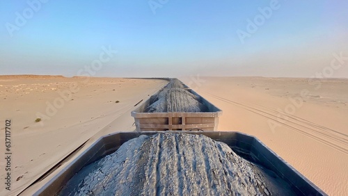 Cargo train pictured in a desert landscape. Mauritania. photo