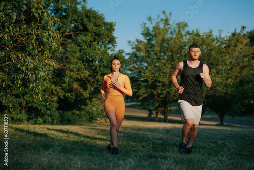 Exuding athleticism and determination, a sportswoman and her male personal trainer engage in a joint running exercise, embracing an active lifestyle and healthy living. © Alexandr