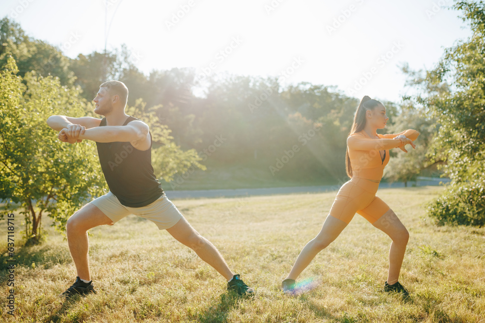 Healthy Lifestyle Active Man and Woman Exercising. Sporty Morning Young Couple Doing Workout at Sunrise, Athleticspirit Healthy Lifestyle Active Man and Woman Exercising. Sporty Morning Young Couple Doing Workout at Sunrise, Athleticspirit