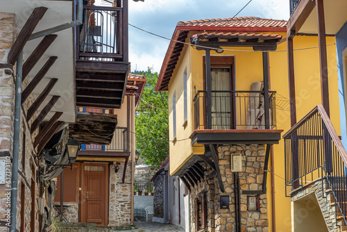 Vintage cobblestone street with vintage houses in Greece
