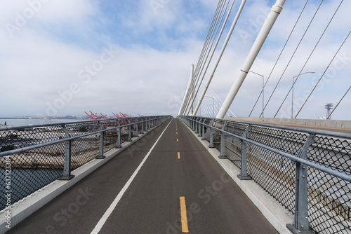 Εκτύπωση καμβά View of the bicycle and pedestrian lane on the new Long Beach International Gateway Bridge leading to Terminal Island in Los Angeles County, California